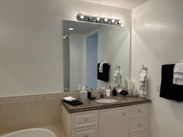 bathroom with vanity and a textured ceiling