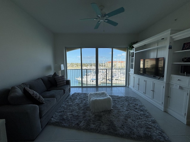 tiled living room with ceiling fan