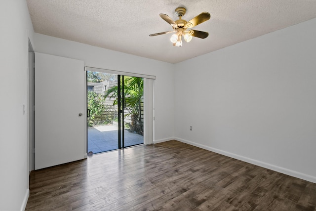 spare room featuring dark hardwood / wood-style flooring, a textured ceiling, and ceiling fan