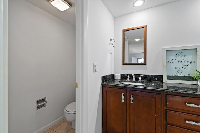 bathroom with tile patterned floors, toilet, and vanity