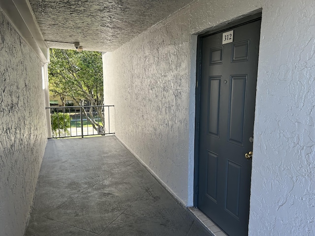 doorway to property with stucco siding