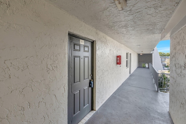 property entrance with stucco siding