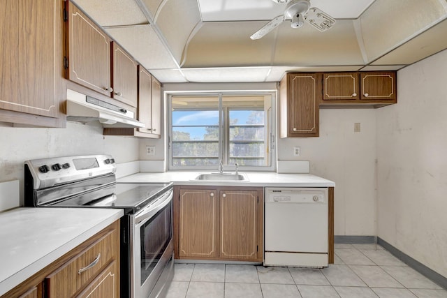 kitchen with light countertops, a sink, stainless steel range with electric stovetop, dishwasher, and under cabinet range hood