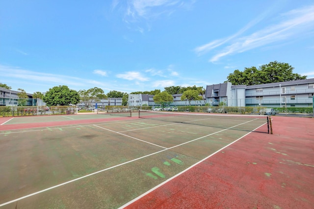 view of sport court with fence