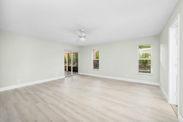 spare room featuring ceiling fan and light hardwood / wood-style flooring