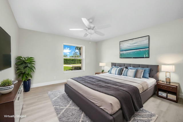 bedroom featuring ceiling fan and light wood-type flooring