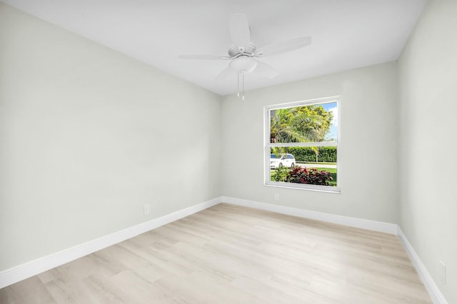 spare room featuring ceiling fan and light hardwood / wood-style floors