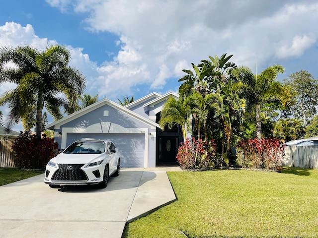 view of front of home featuring a garage and a front yard