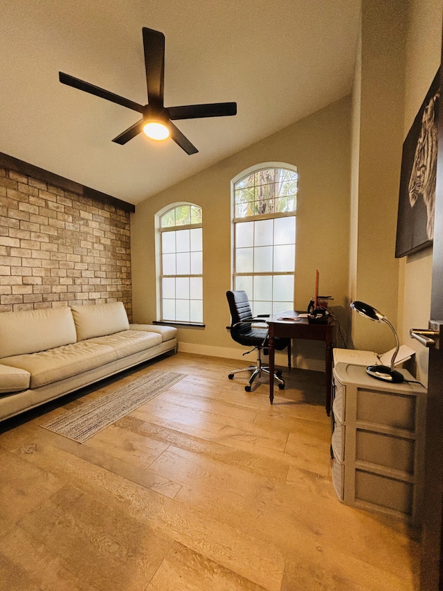 office featuring ceiling fan, light hardwood / wood-style flooring, and a healthy amount of sunlight