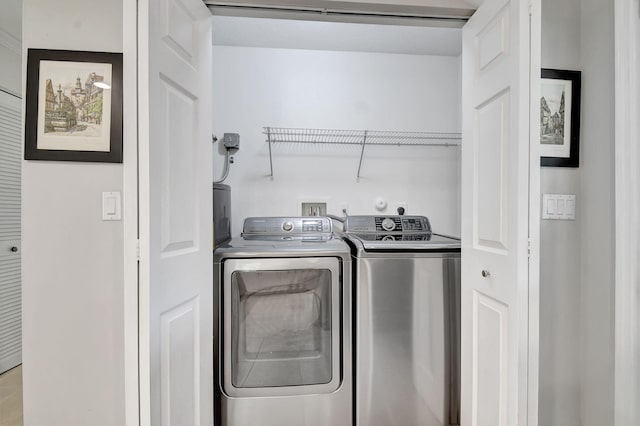 laundry area featuring washing machine and clothes dryer