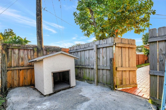 view of patio featuring a storage shed