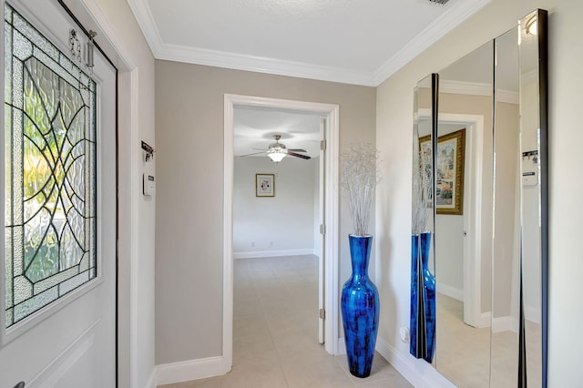 interior space with ornamental molding and light tile patterned floors