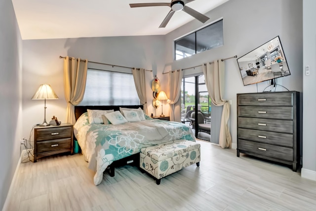 bedroom with lofted ceiling, light wood-type flooring, and ceiling fan