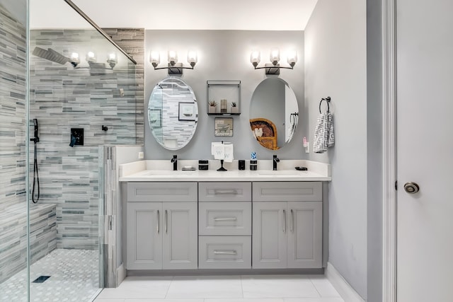 bathroom with vanity, tile patterned floors, and a shower with shower door