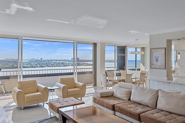 living room with ornamental molding, floor to ceiling windows, and a water view