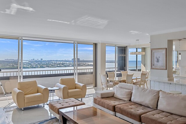 balcony featuring a water view and a view of the beach