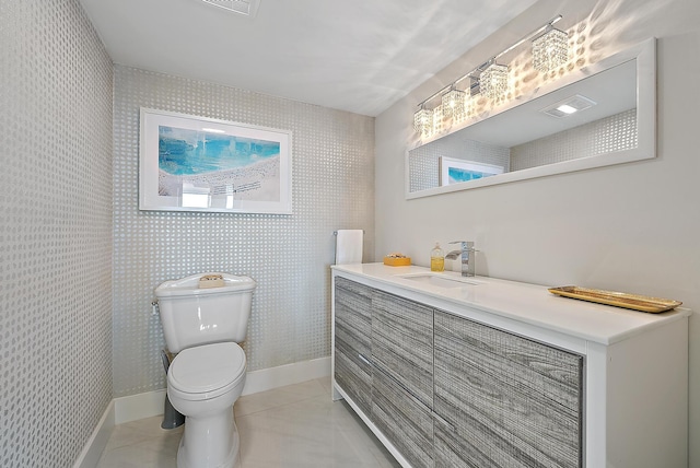 bathroom with tile patterned floors, toilet, and vanity