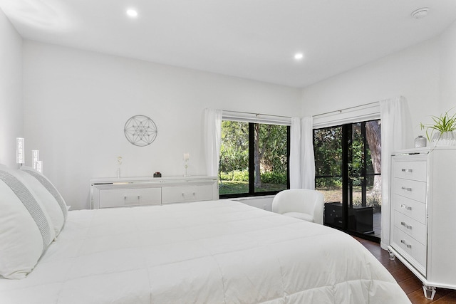 bedroom with dark wood-type flooring and recessed lighting