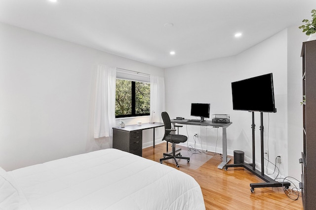 bedroom with recessed lighting, baseboards, and light wood finished floors