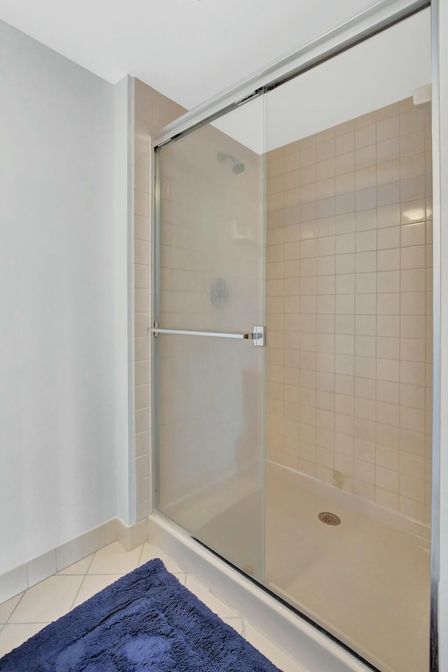 bathroom featuring tile patterned flooring and walk in shower