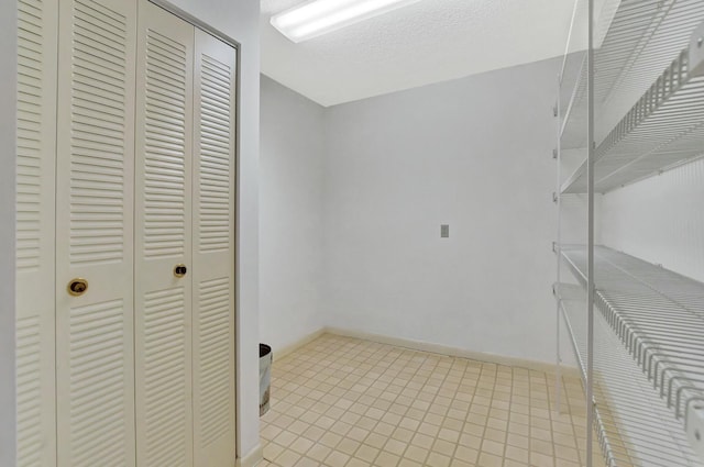 washroom featuring a textured ceiling