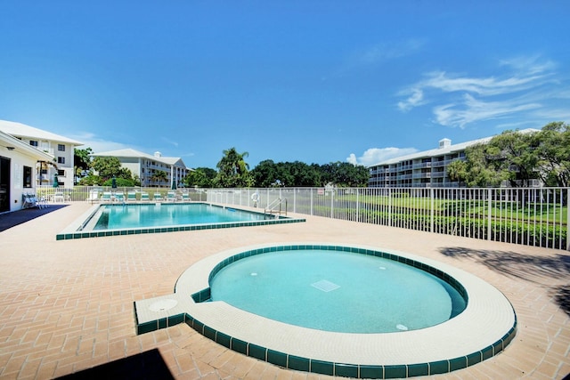 view of pool featuring a patio area