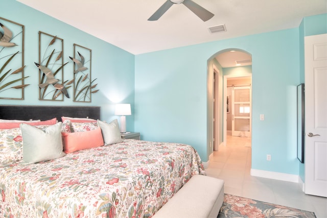 tiled bedroom with ceiling fan