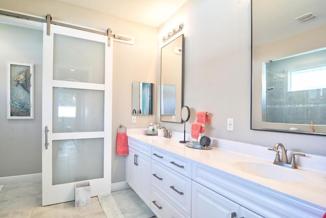 bathroom with vanity, a shower, and tile patterned floors