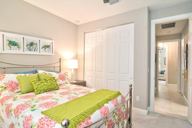 carpeted bedroom featuring a closet