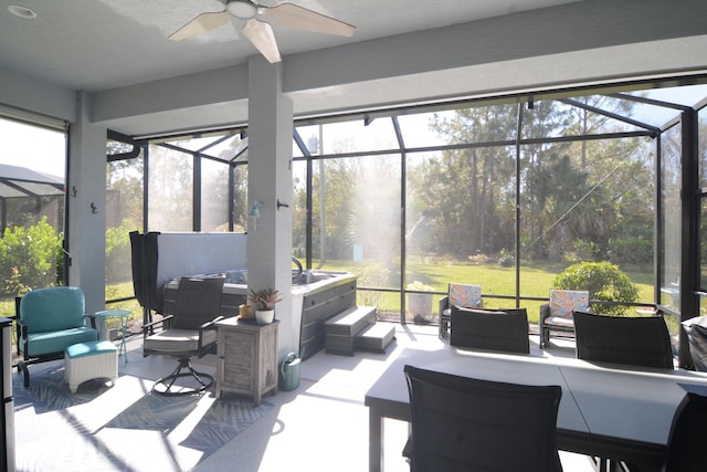 sunroom / solarium with ceiling fan and a healthy amount of sunlight