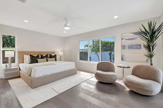 bedroom featuring ceiling fan and light hardwood / wood-style floors