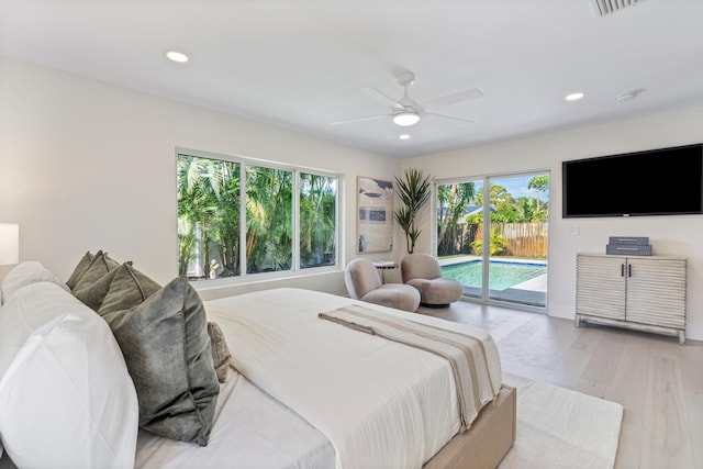 bedroom with light hardwood / wood-style flooring, ceiling fan, and access to exterior