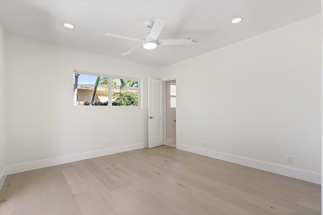 spare room with ceiling fan and light hardwood / wood-style floors