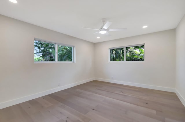 unfurnished room with light hardwood / wood-style flooring and ceiling fan