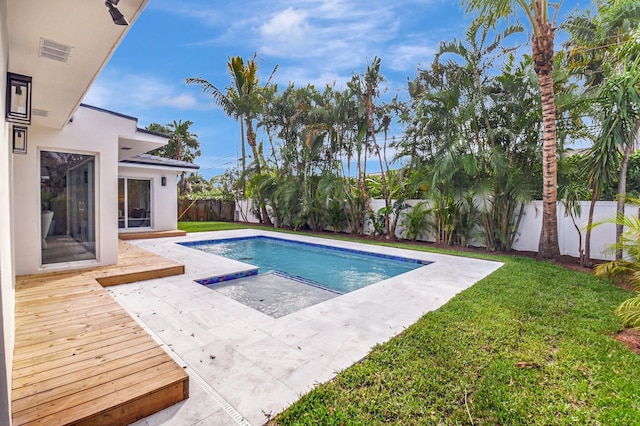 view of pool featuring a yard