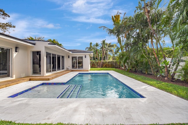 view of swimming pool with a patio