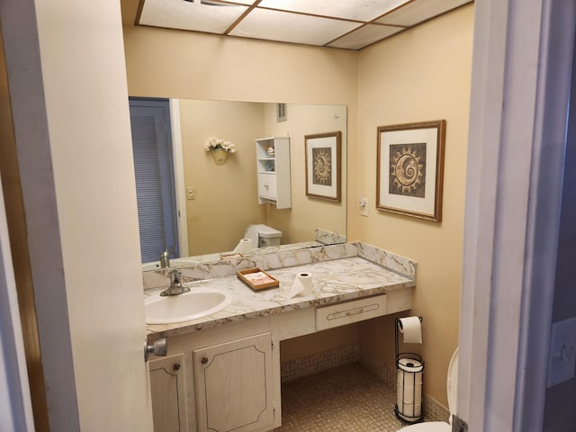 bathroom with vanity, tile patterned floors, and toilet