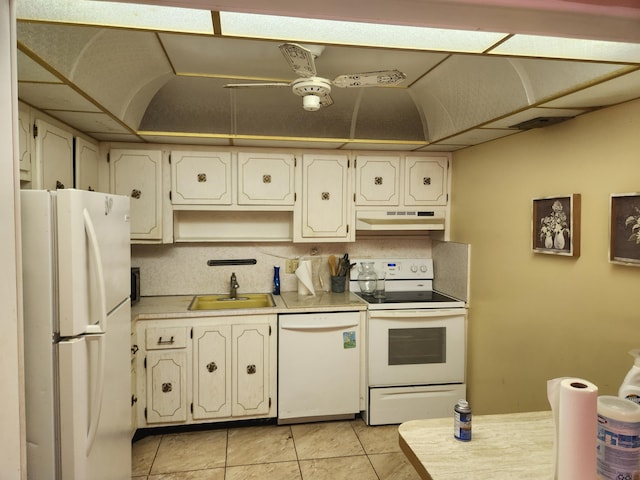 kitchen with sink, white appliances, and light tile patterned flooring