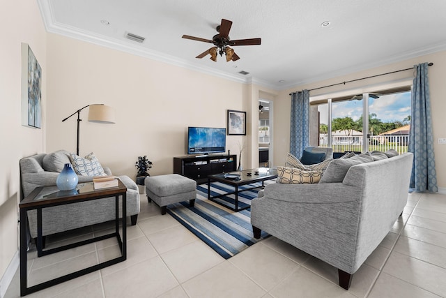 living room featuring visible vents, crown molding, and light tile patterned floors