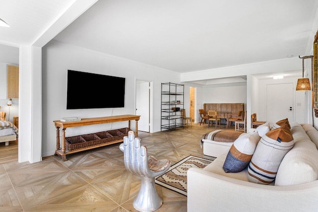 living room featuring parquet flooring and ornamental molding