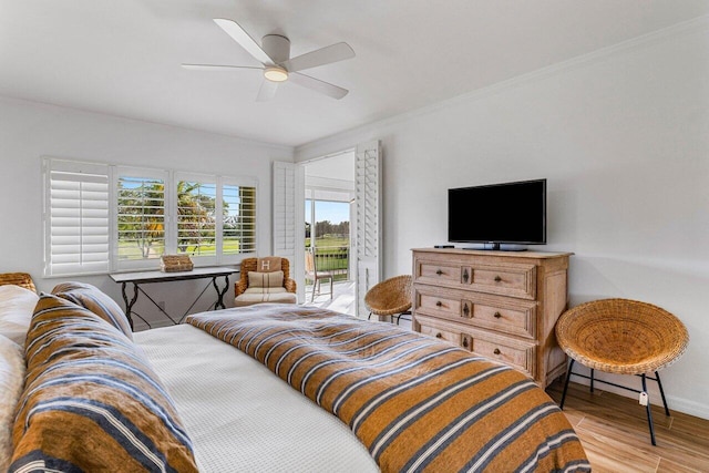 bedroom featuring ornamental molding, access to exterior, ceiling fan, and light hardwood / wood-style flooring