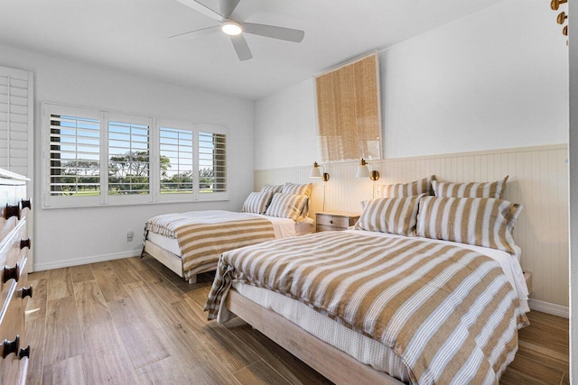 bedroom featuring wood-type flooring and ceiling fan