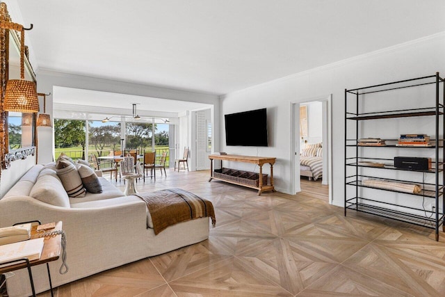 living room with ornamental molding and light parquet flooring