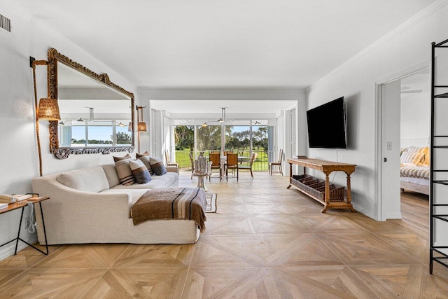 living room featuring ornamental molding and light parquet floors