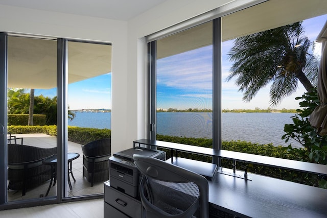 office space with a water view and a wealth of natural light