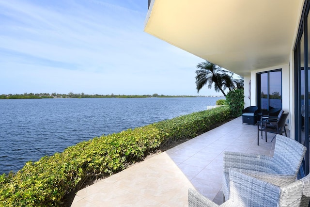 view of patio / terrace with a water view