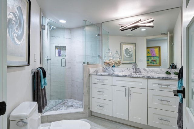 bathroom featuring vanity and a shower with shower door