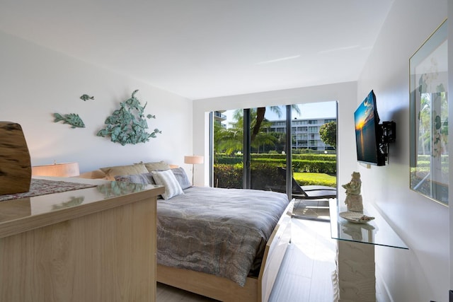 bedroom with light wood-type flooring