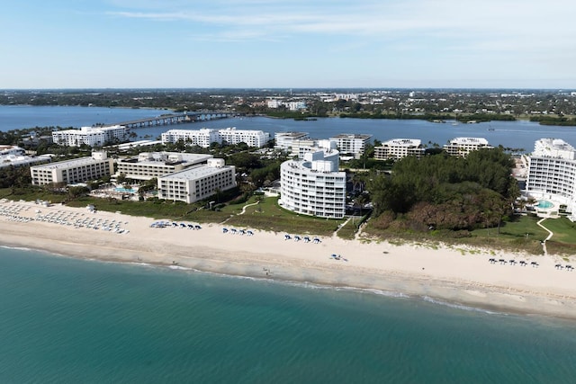 drone / aerial view featuring a view of the beach and a water view