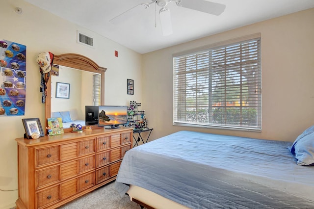 bedroom featuring ceiling fan and light colored carpet